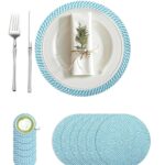 Blue and white woven braided placemat set arranged on a dining table with a white plate, napkin, fork, and knife.