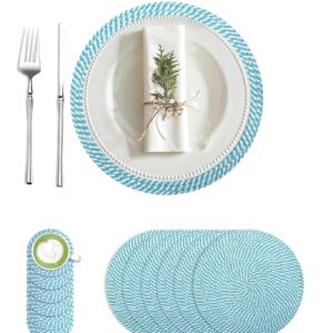 Blue and white woven braided placemat set arranged on a dining table with a white plate, napkin, fork, and knife.