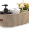 Beige woven rope storage basket with leather handles for home organization