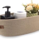 Beige woven rope storage basket with leather handles for home organization